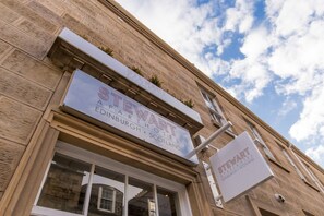 A hotel sign with the name 'STEWART APART HOTEL' and location 'EDINBURGH, SCOTLAND'. - Stewart by Heeton Concept (Edinburgh)