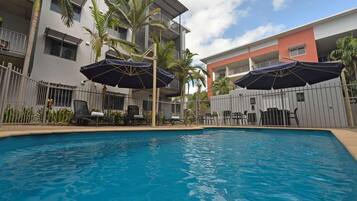 Outdoor pool, pool umbrellas, sun loungers