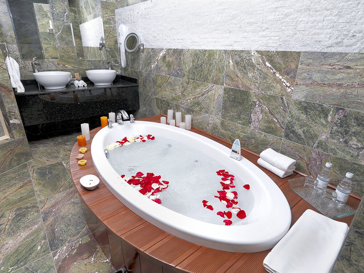 suite, 2 queen beds, balcony (street view) | bathroom | combined shower/bathtub, jetted bath, free toiletries, hair dryer
