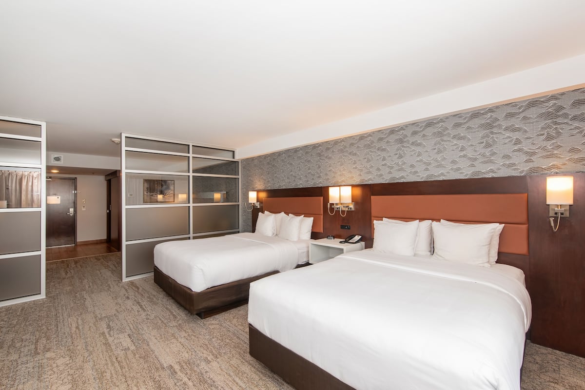 premium bedding, pillow-top beds, desk, laptop workspace