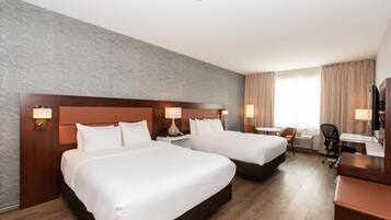 Premium bedding, pillow-top beds, desk, laptop workspace