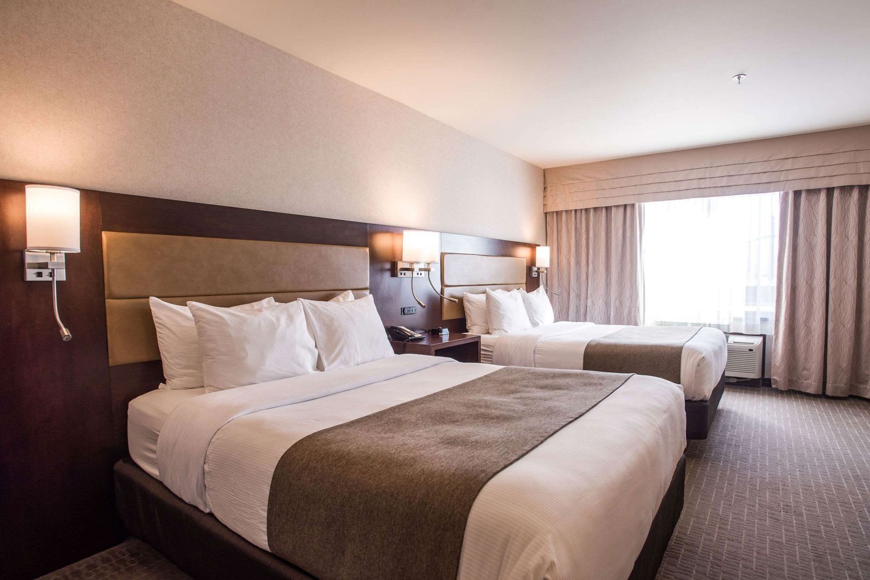 Premium bedding, pillowtop beds, desk, laptop workspace