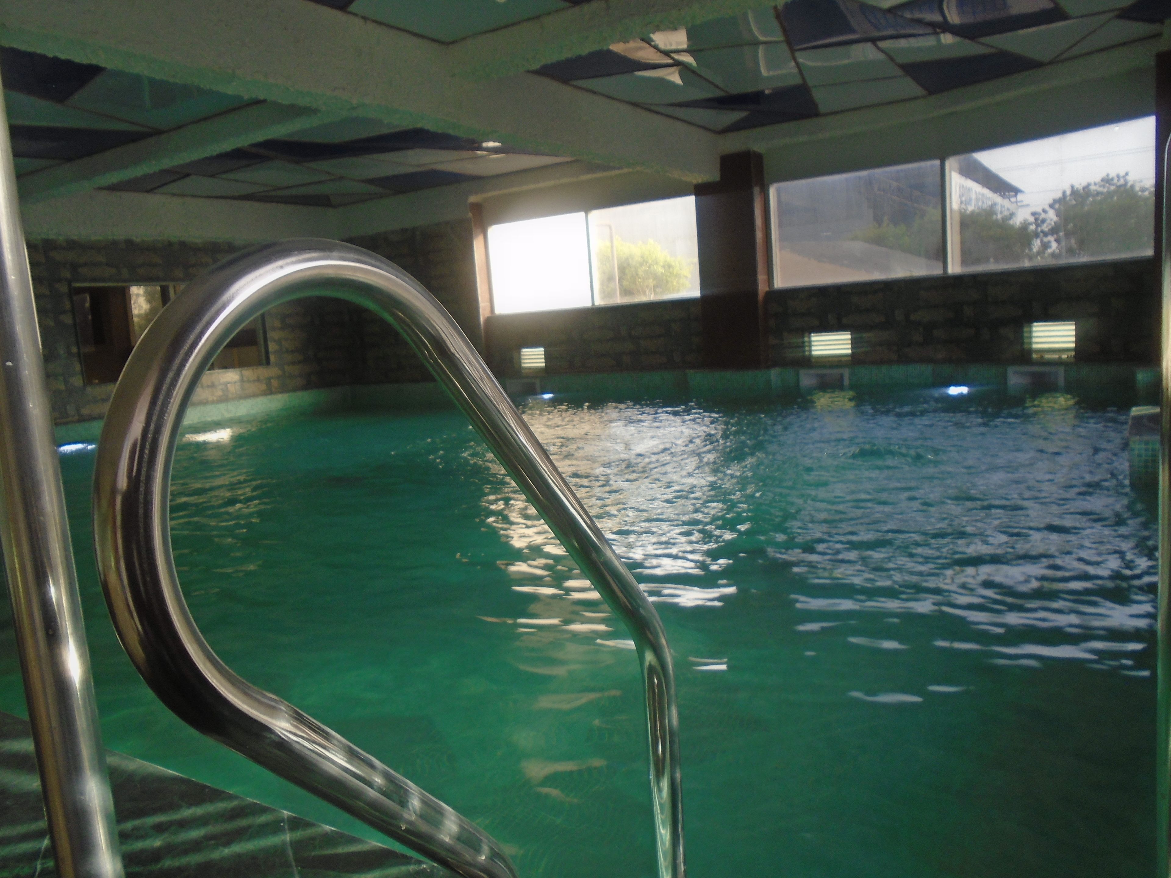 Indoor pool, open 8:00 AM to 8:00 PM, pool loungers