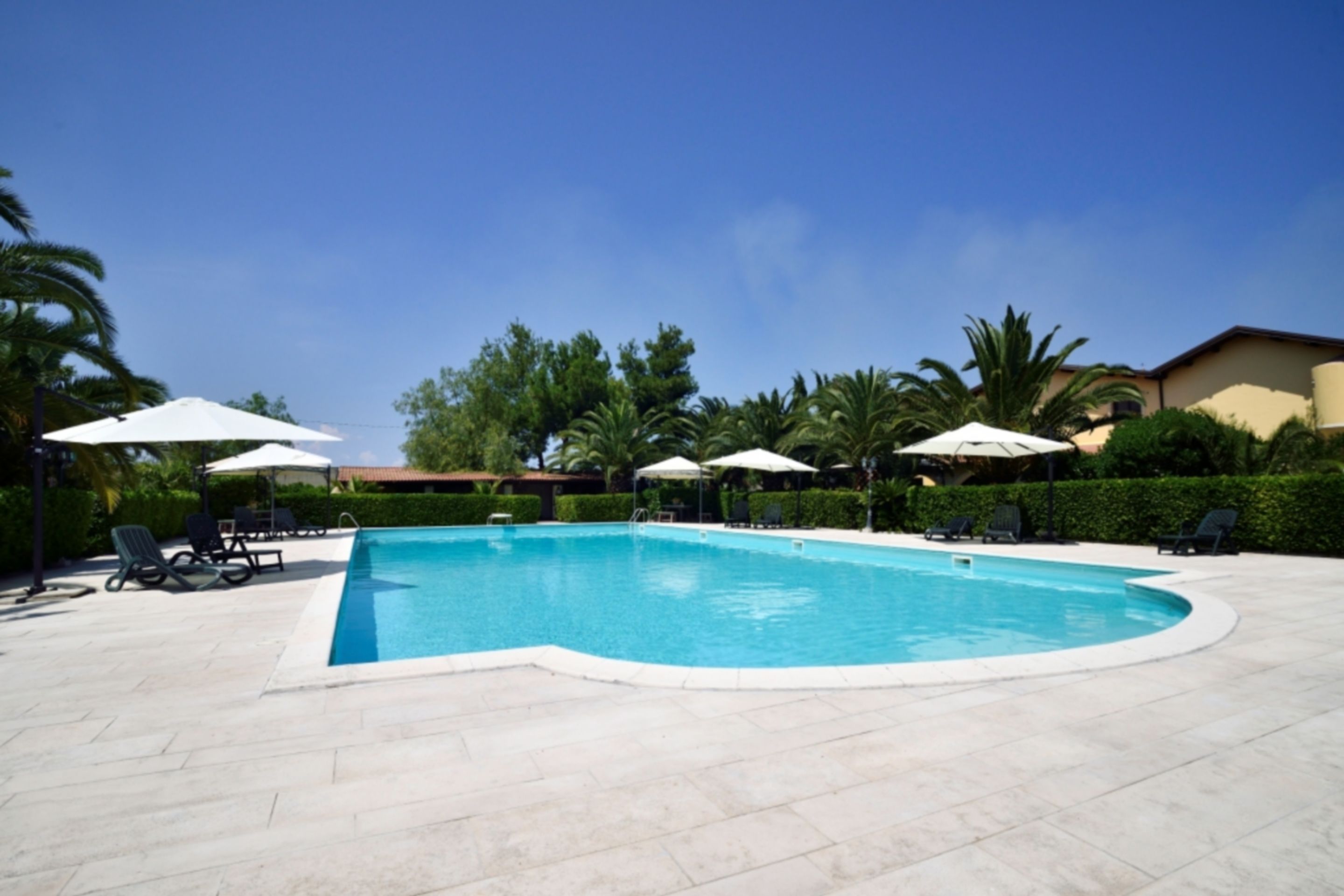 outdoor pool, pool umbrellas, pool loungers