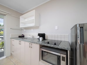 1 Bedroom Apartment | Living area | 42-inch TV with satellite channels