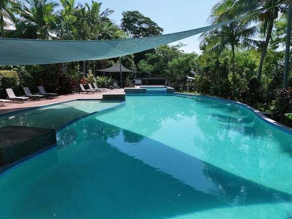 Outdoor pool, open 7:30 AM to 8:30 PM, pool umbrellas, pool loungers