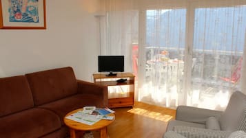 Standard Apartment, 2 Bedrooms, Balcony, Mountain View | Living area | TV