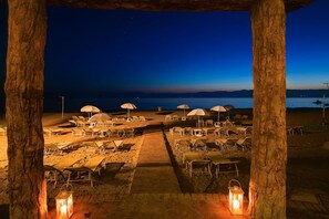 On the beach, beach cabanas, sun-loungers, beach umbrellas