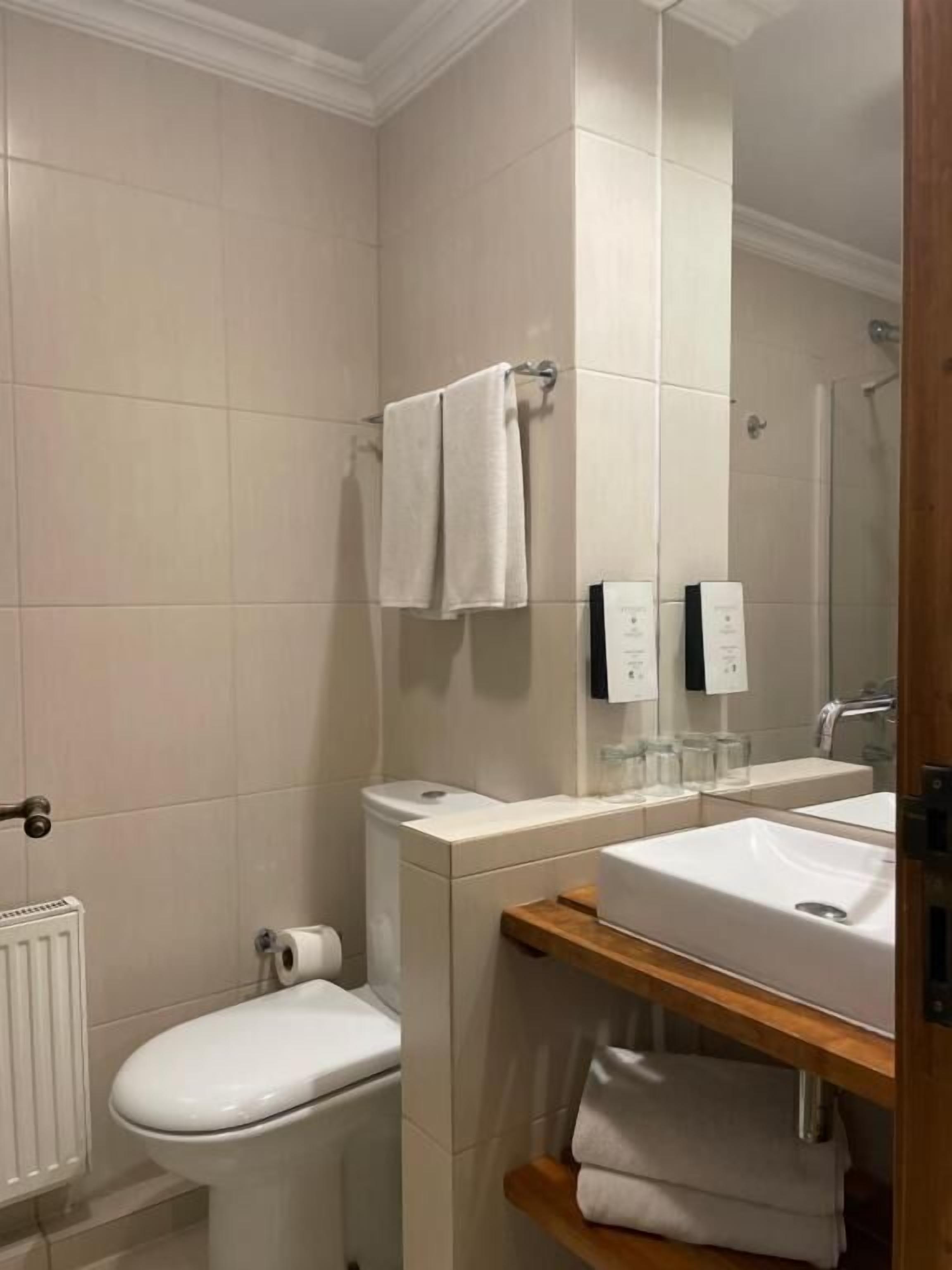 deep-soaking bathtub, rainfall showerhead, eco-friendly toiletries