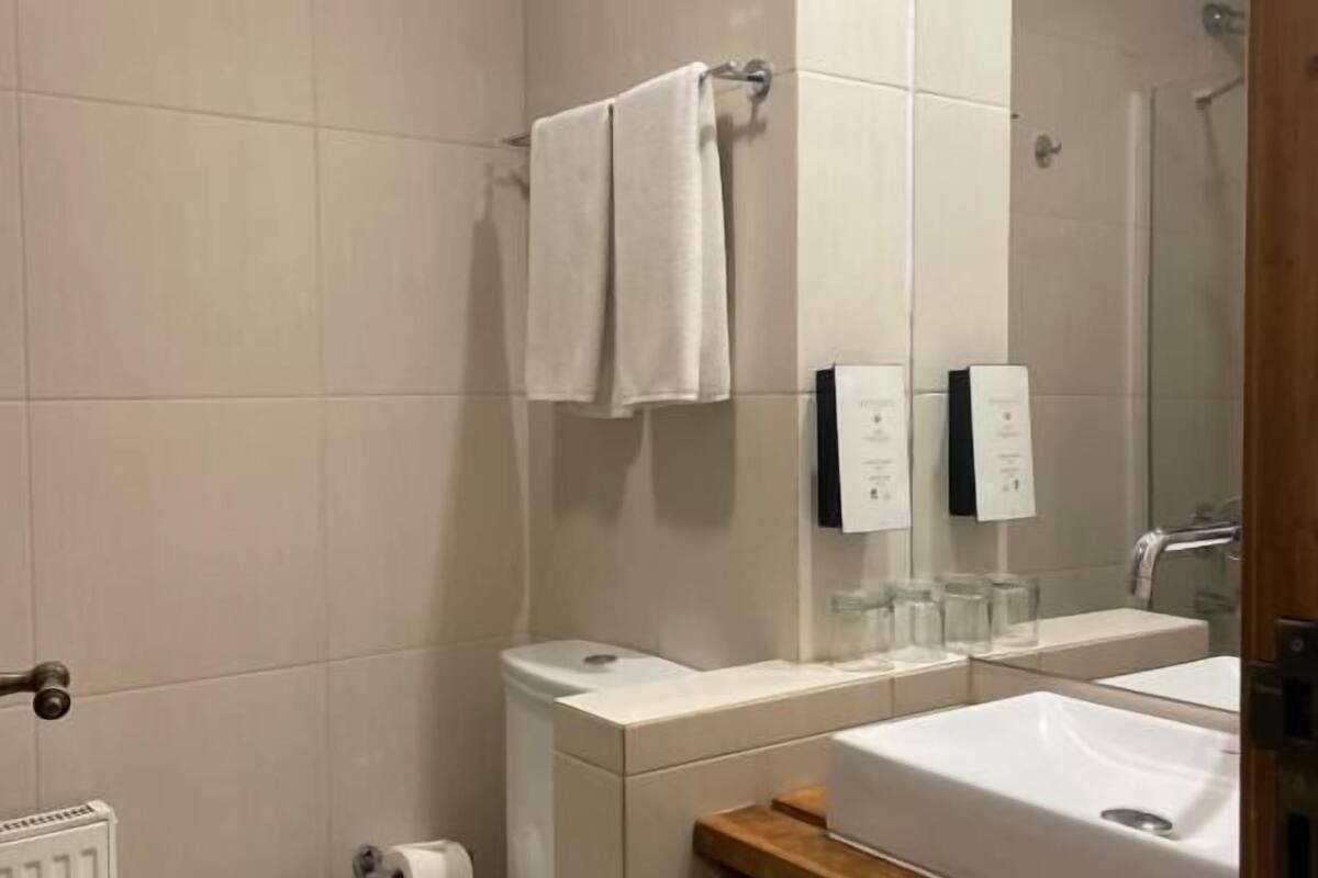 deep-soaking bathtub, rainfall showerhead, eco-friendly toiletries