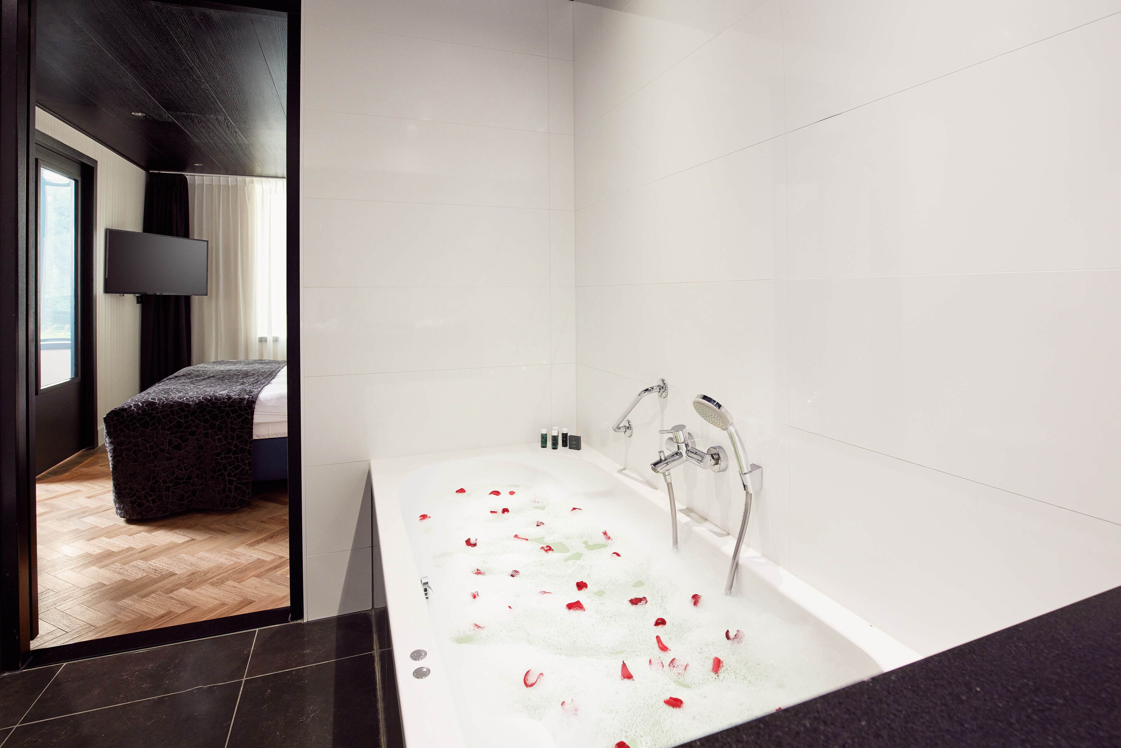 whirlpool suite | bathroom | free toiletries, hair dryer, towels, soap