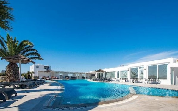 Seasonal outdoor pool, pool loungers