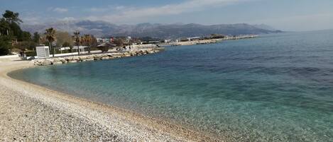 Beach nearby, white sand, beach towels