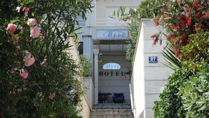 A hotel entrance with a sign reading "More Hotel" and a number "27" on the wall. - Hotel More (Split)