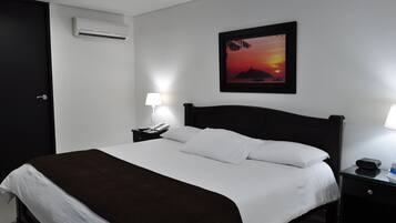 Standard Double Room | Minibar, in-room safe, desk, blackout curtains