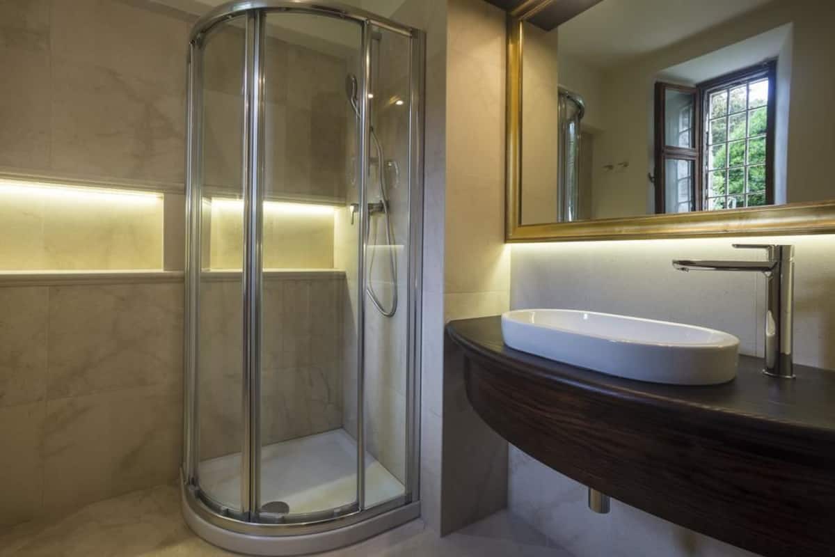 junior suite | bathroom | shower, rainfall showerhead, hair dryer, slippers
