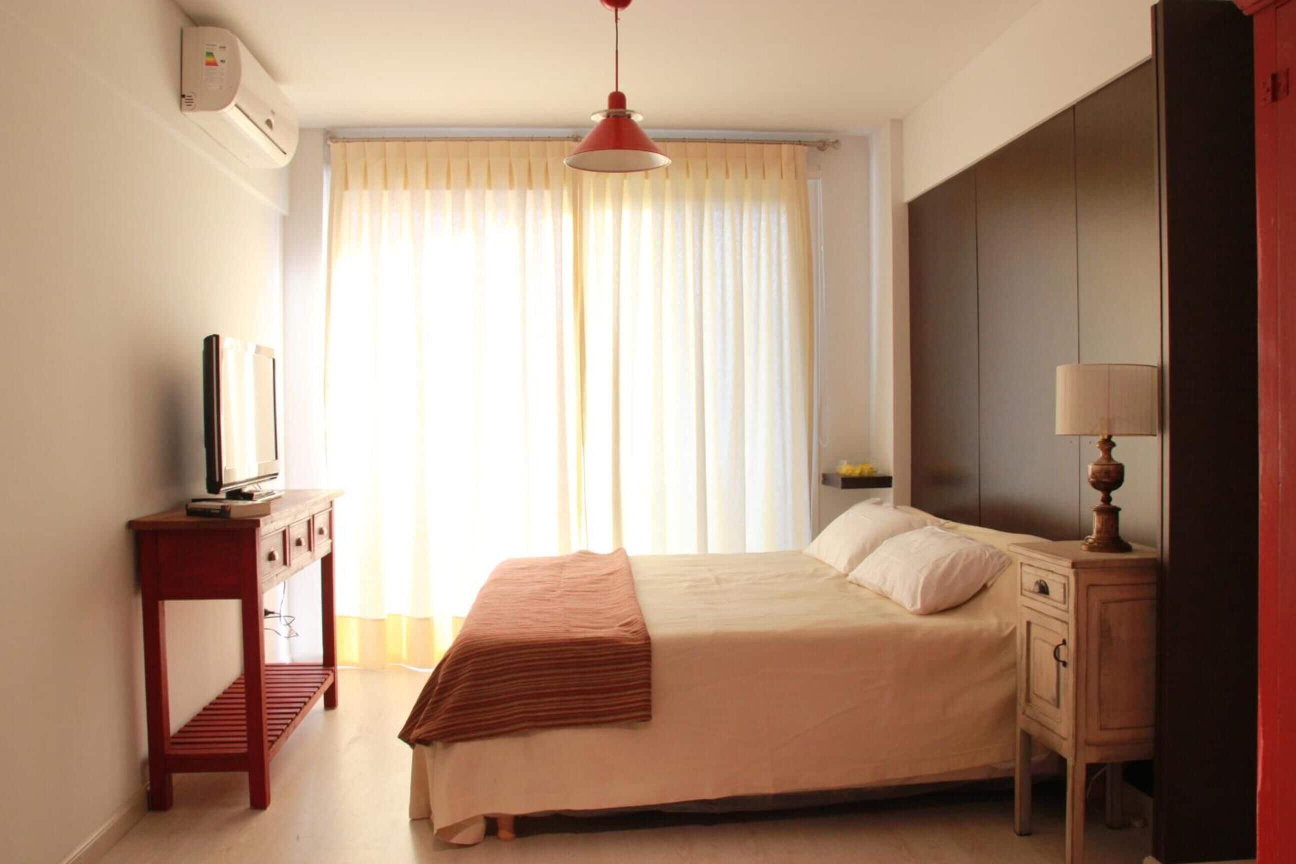 Tabla de planchar con plancha, camas extra, wifi gratis y ropa de cama 
