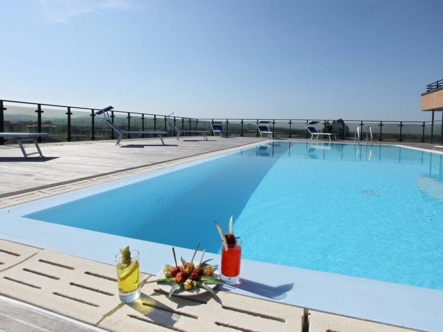 Outdoor pool, open 10 AM to 11 PM, pool loungers