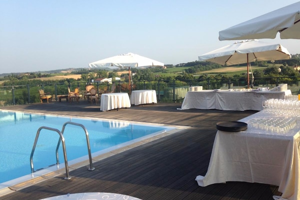 Outdoor pool, open 10 AM to 11 PM, sun loungers