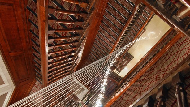 A grand staircase with ornate woodwork and a patterned ceiling. - Park Grand Mayfair (London)
