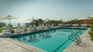 Seasonal outdoor pool, pool umbrellas, pool loungers