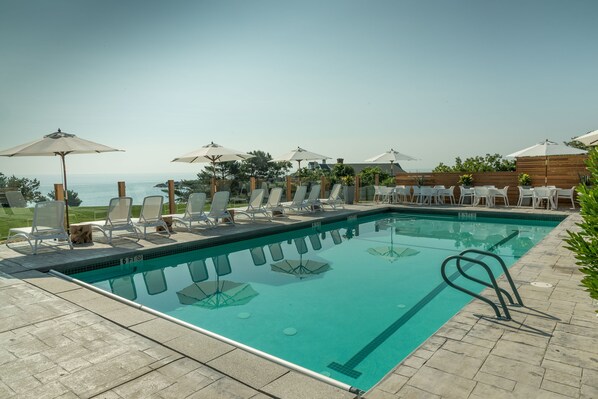 Seasonal outdoor pool, pool umbrellas, pool loungers