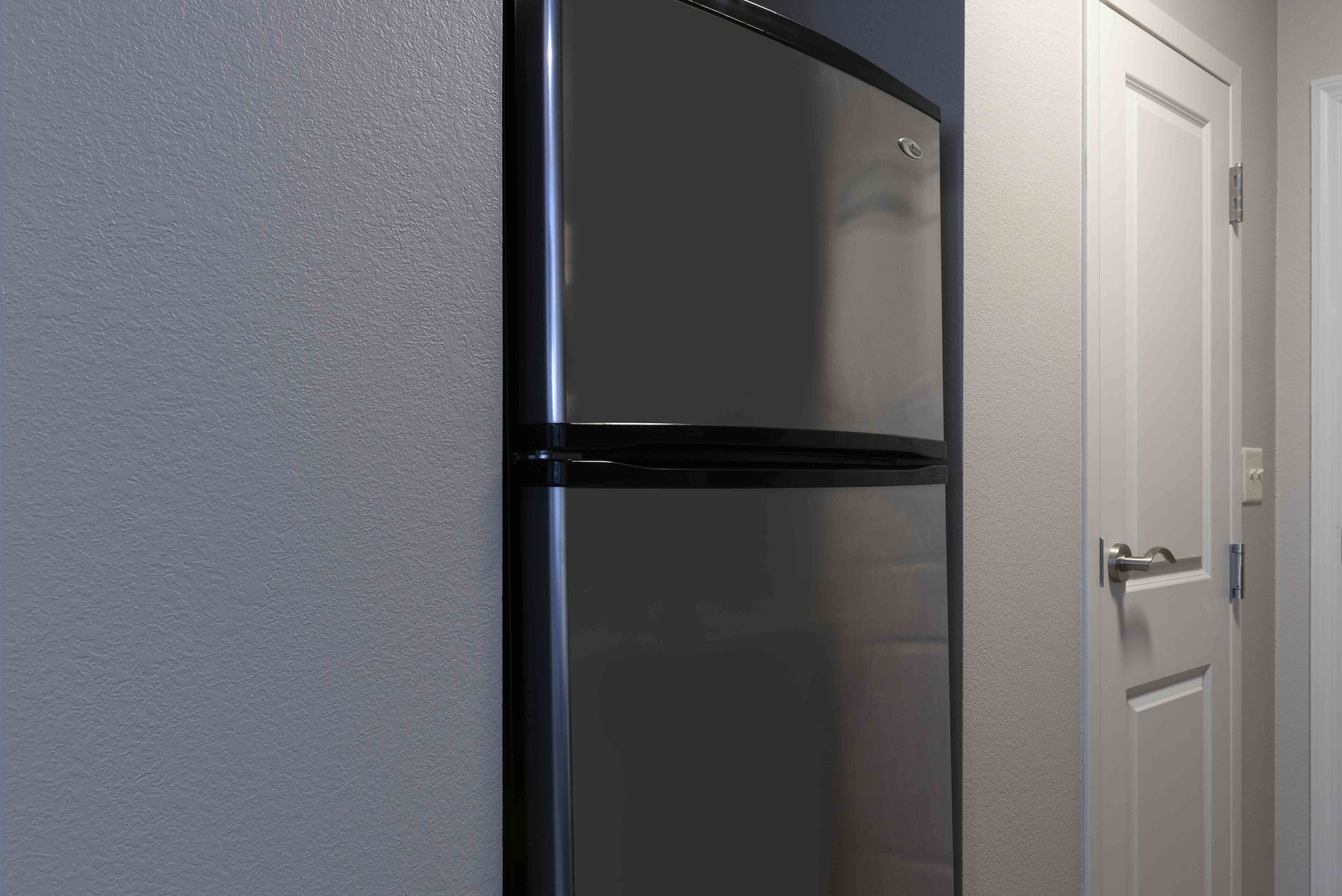 full-sized fridge, microwave, stovetop, dishwasher