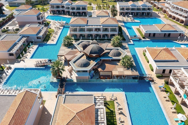 Indoor pool, seasonal outdoor pool, pool umbrellas, sun loungers