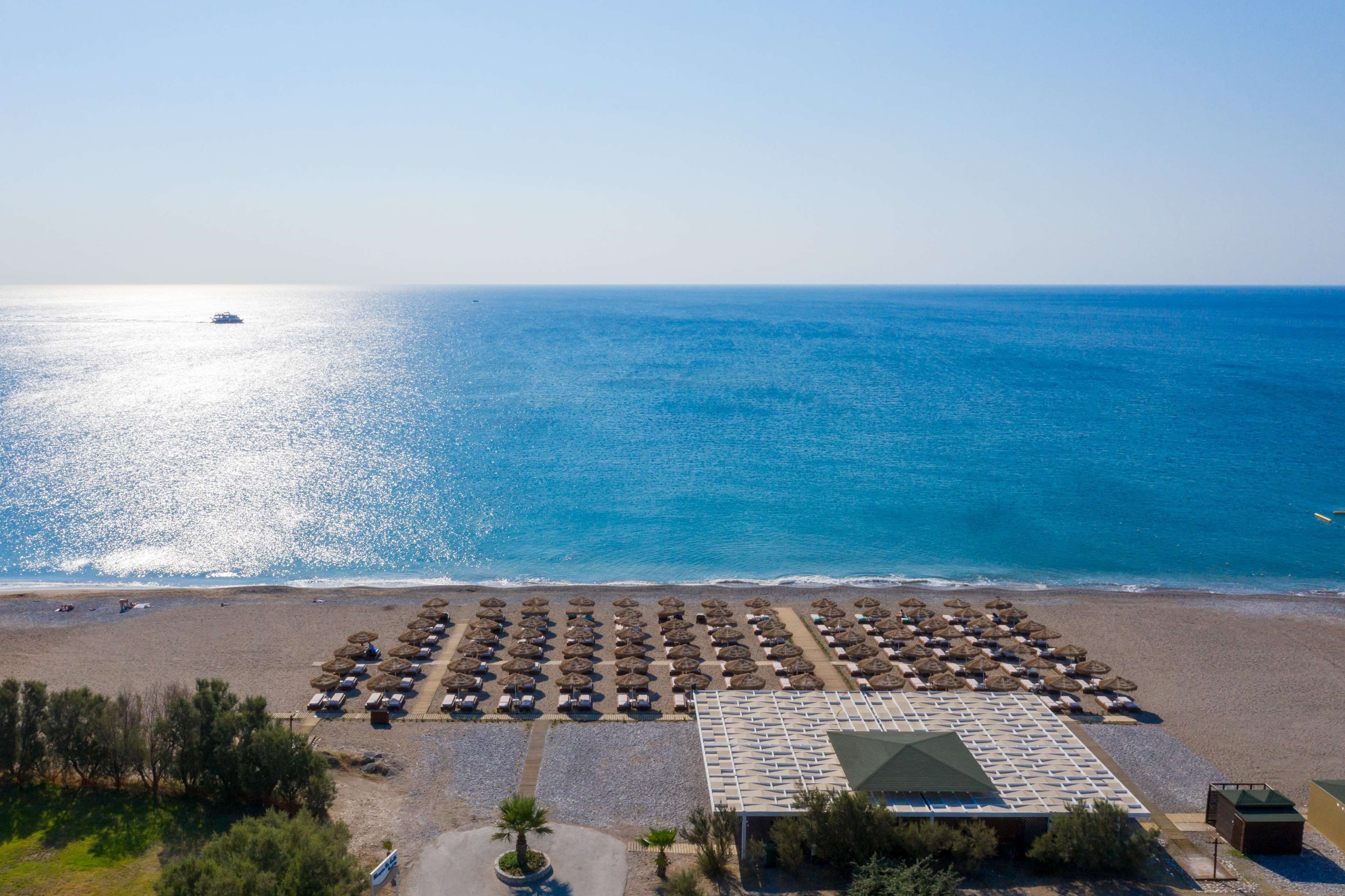 private beach, sun-loungers, beach umbrellas, beach towels