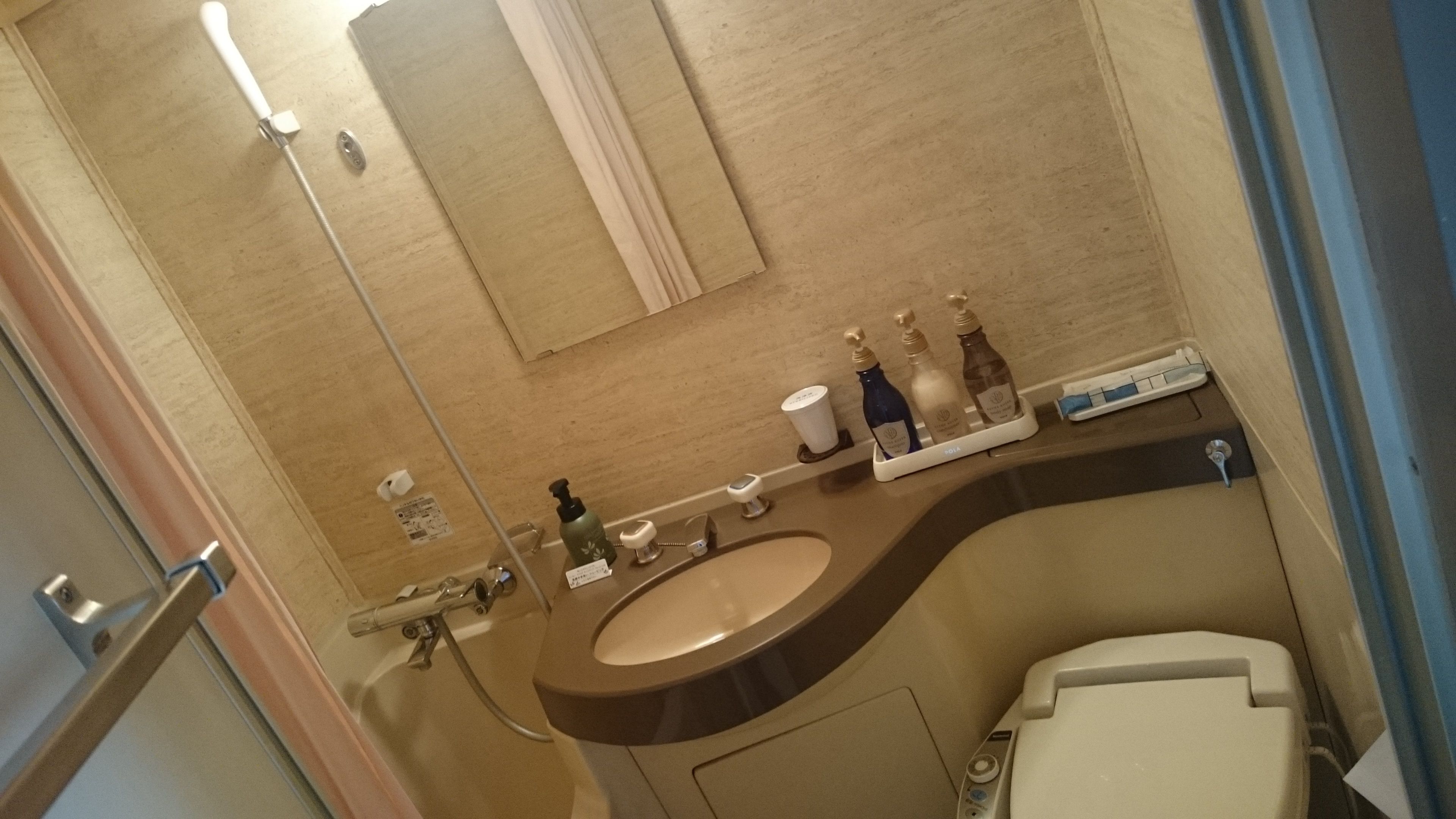 hair dryer, slippers, electronic bidet, towels