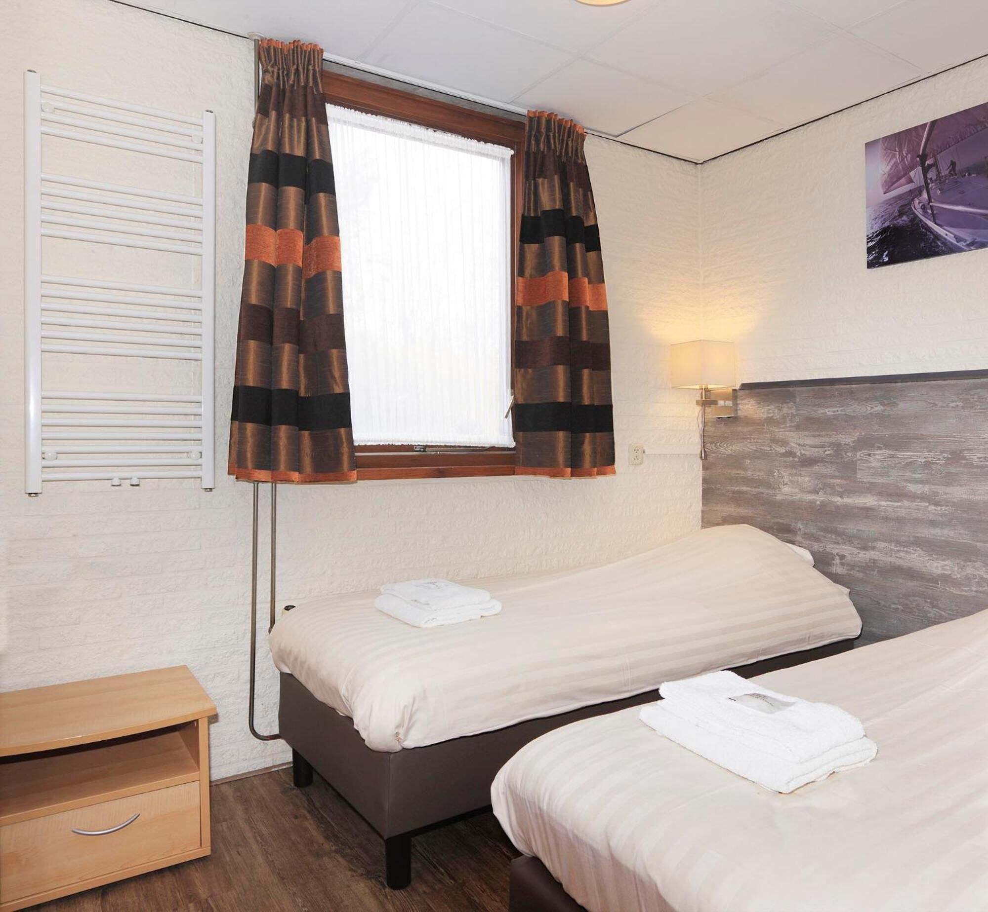 hypo-allergenic bedding, select comfort beds, in-room safe, desk