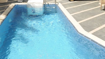 Outdoor pool, open 9:00 AM to 6:00 PM, sun loungers