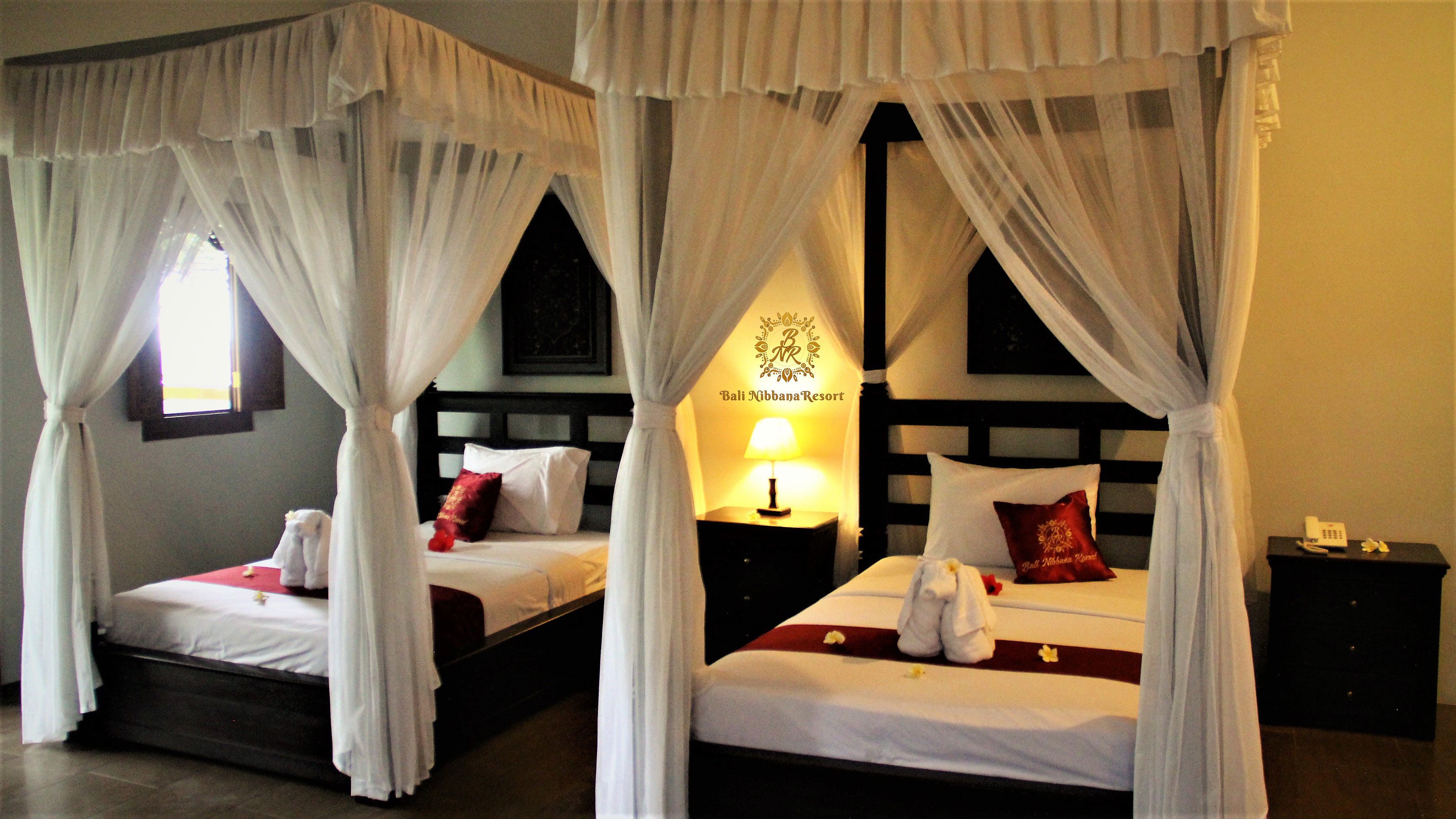 deluxe room, garden view | minibar, in-room safe, individually decorated, individually furnished