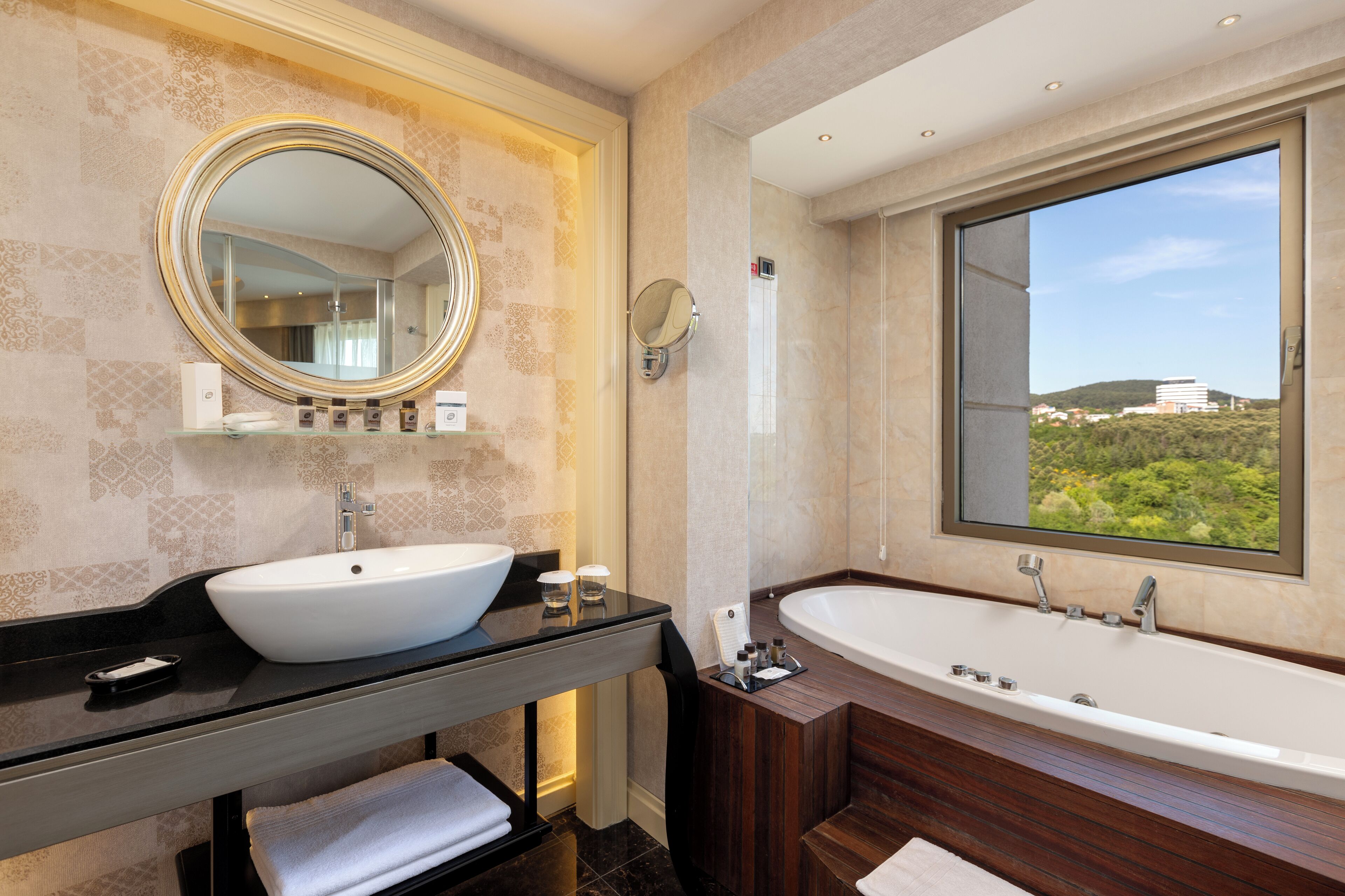 corner room with jacuzzi tub | bathroom | free toiletries, hair dryer, bathrobes, slippers