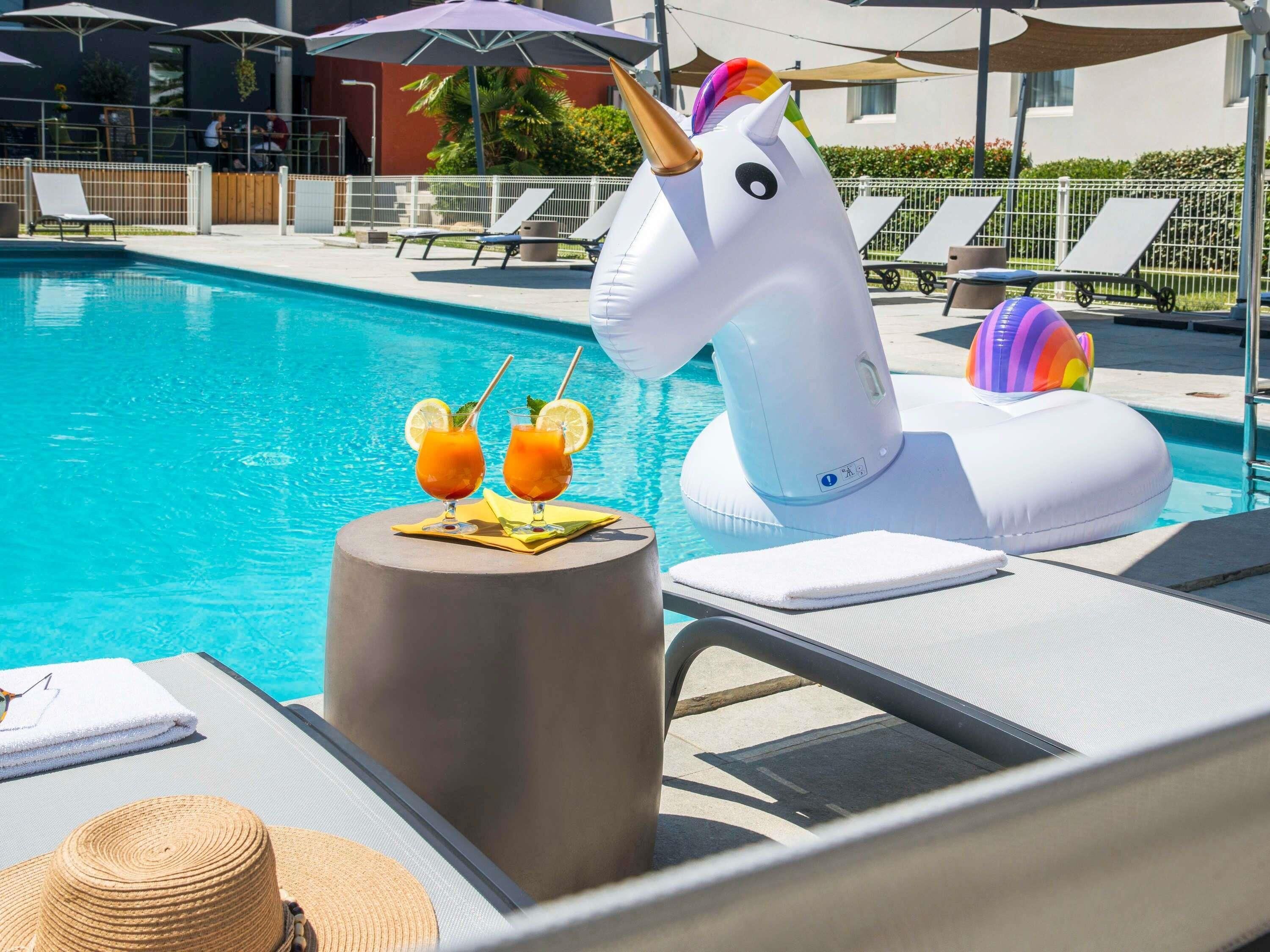 Outdoor pool, open 7:30 AM to 9:30 PM, pool loungers