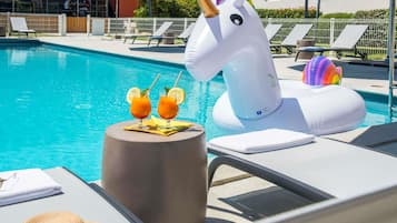 Outdoor pool, open 7:30 AM to 9:30 PM, pool loungers