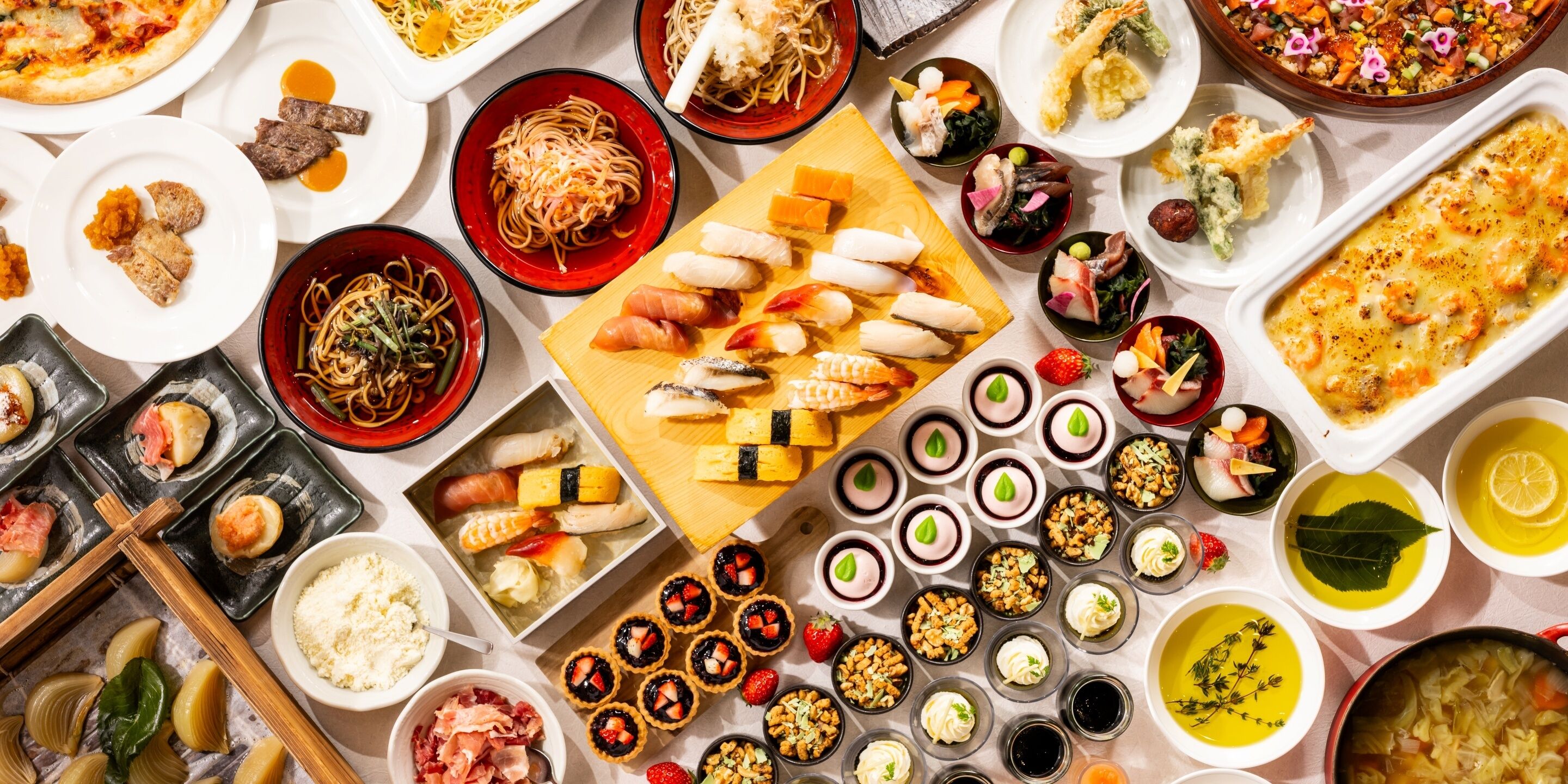A variety of dishes and food items on a table.
