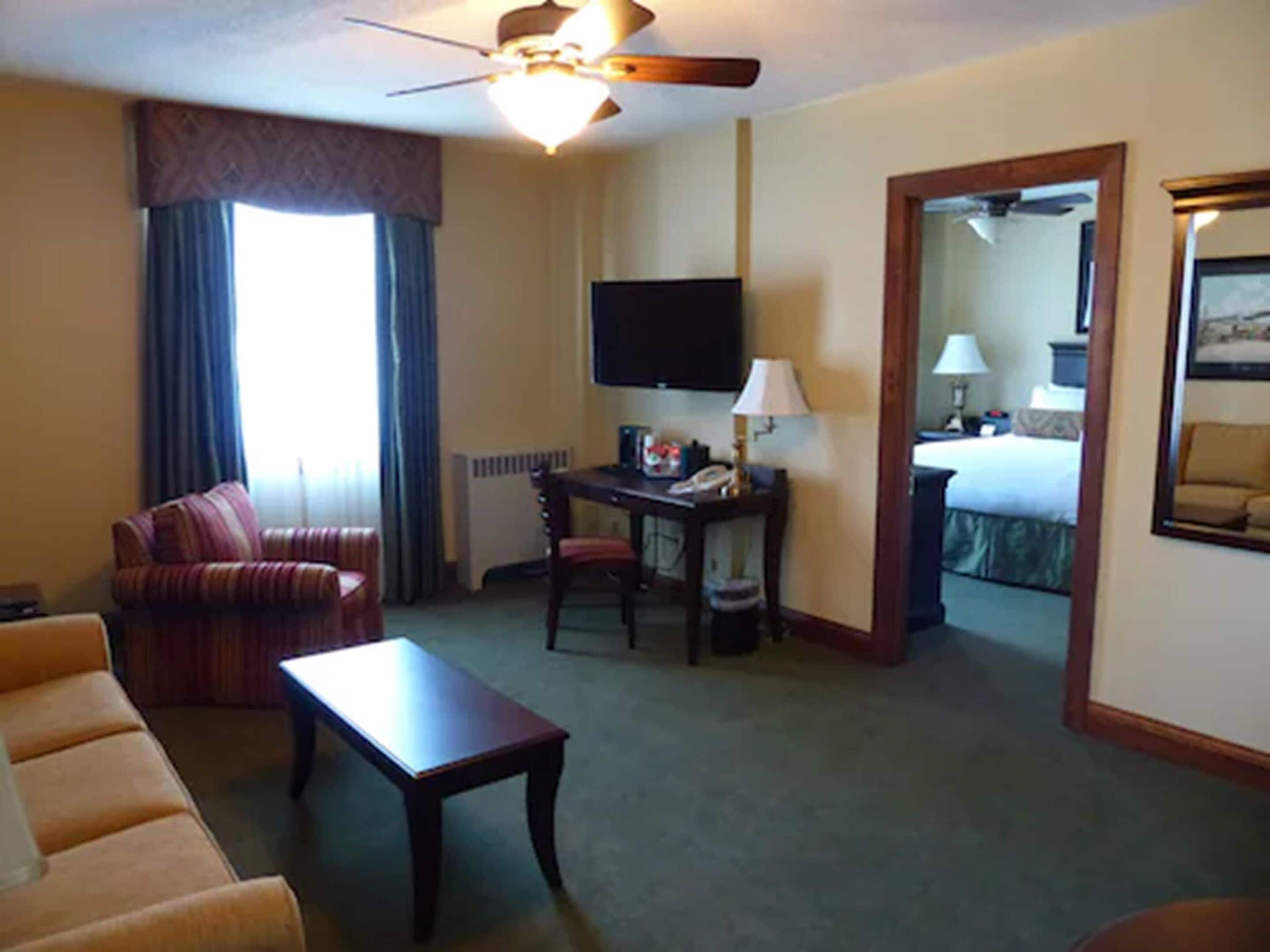 deluxe room, 1 queen bed with sofa bed, non smoking | premium bedding, desk, iron/ironing board, free cots/infant beds