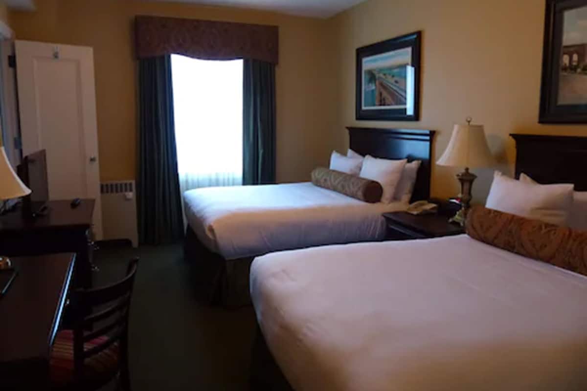 Deluxe Room, 2 Queen Beds, Non Smoking | Premium bedding, desk, iron/ironing board, free cribs/infant beds