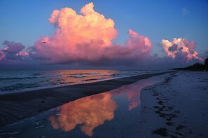 A beach with a large cloud formation reflecting on wet sand. - Beach Castle Resort by RVA (Longboat Key)