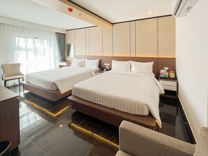 Family Room | Minibar, in-room safe, desk, blackout drapes - Good Vibes Central Hotel (Ho Chi Minh City)