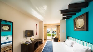 A hotel room with a bed, a desk, a television, and a view of the outdoors. - Al Wadi Hotel Sohar (Sohar)