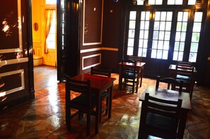 A room with wooden furniture, a tiled floor, and large windows. - De la Rue (Buenos Aires)