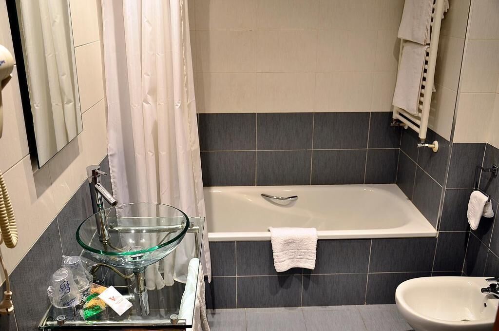 suite | bathroom | shower, hair dryer, towels, soap