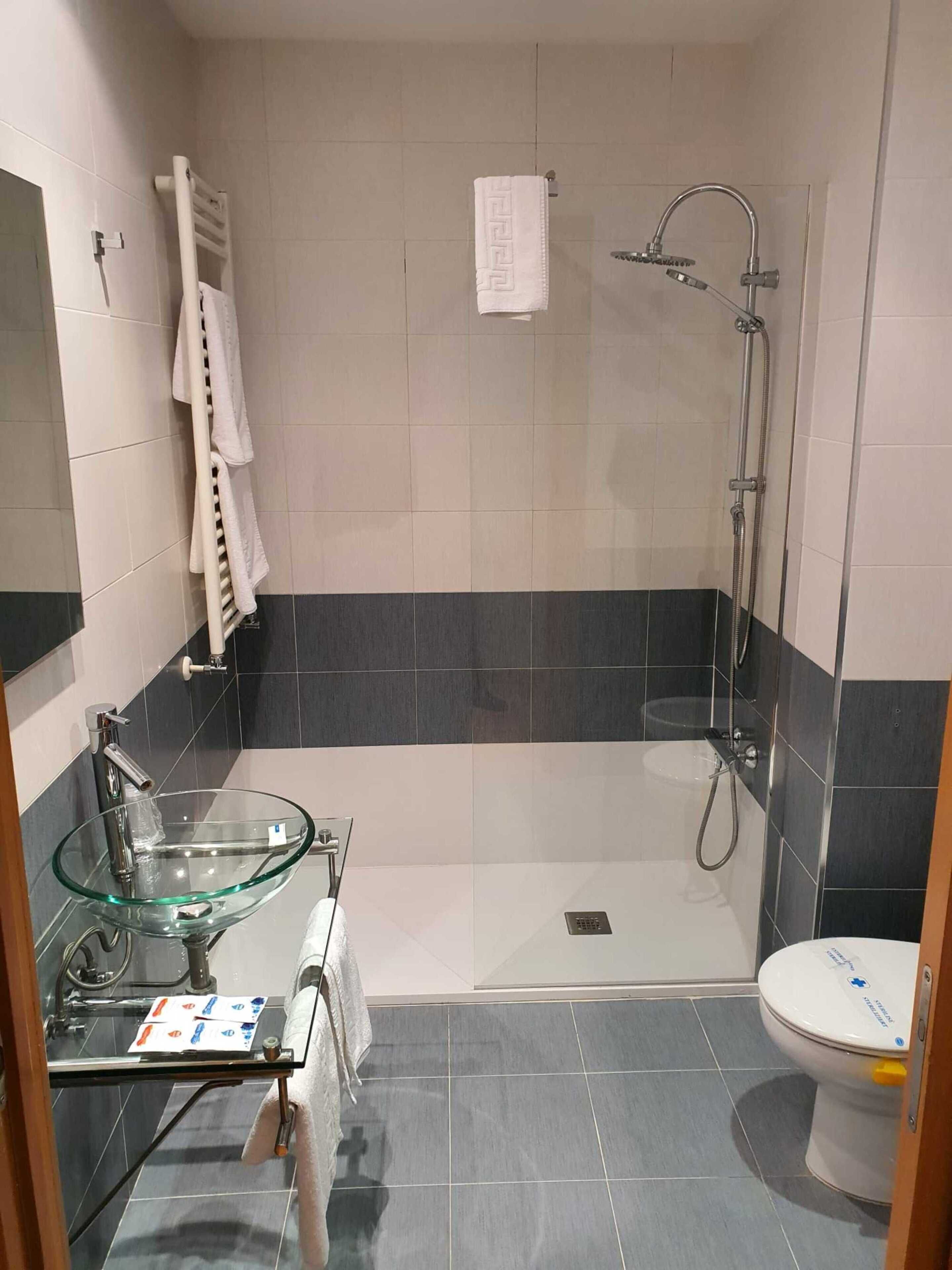 double room | bathroom | shower, hair dryer, towels, soap