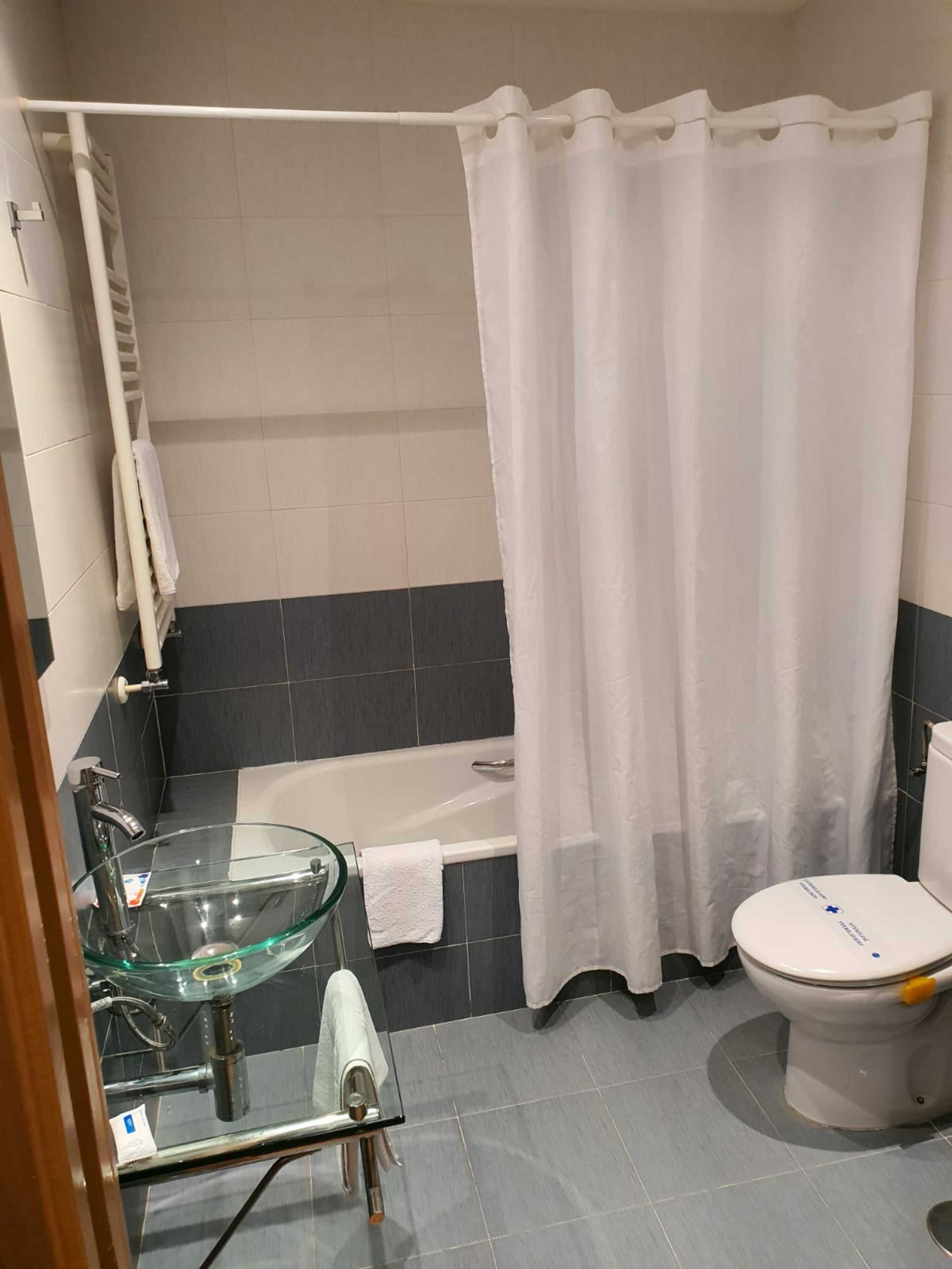 single room | bathroom | shower, hair dryer, towels, soap