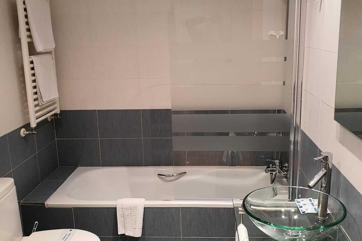 quadruple room | bathroom | shower, hair dryer, towels, soap