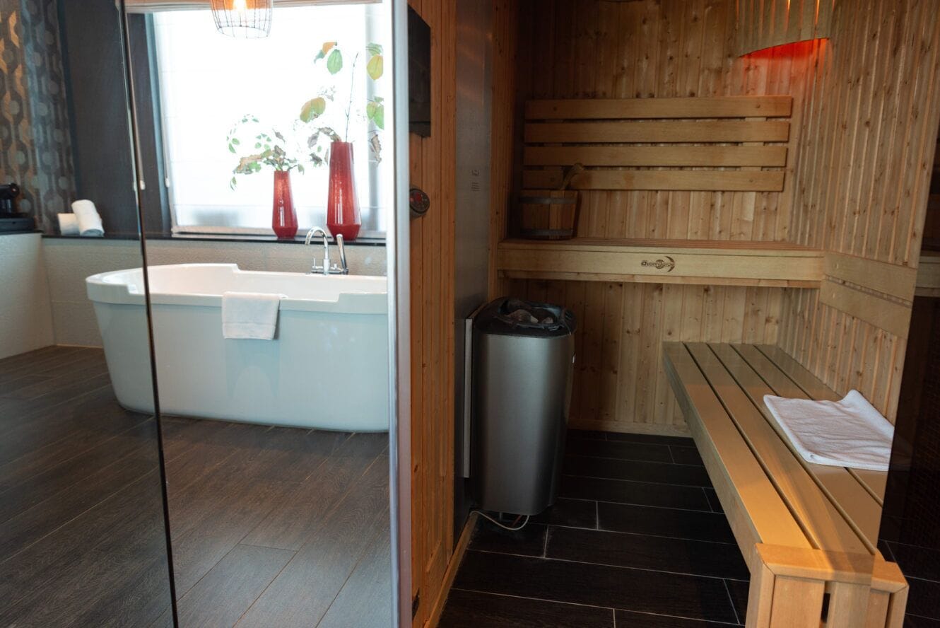 wellness suite (sauna & steamshower) | 1 bedroom, in-room safe, desk, blackout curtains