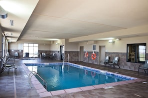 Indoor pool, open 6:00 AM to midnight, pool loungers