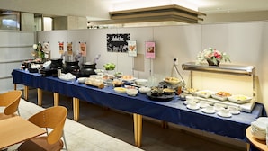 A buffet setup with various dishes and a salad bar in a modern hotel room. - Daiwa Roynet Hotel Nagoya Shinkansenguchi (Nagoya)